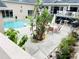 Serene backyard featuring a pool, spa, well-maintained landscaping, and patio area perfect for relaxation at 7941 Sycamore Dr, New Port Richey, FL 34654