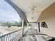 Covered balcony with ceiling fans and view of the backyard at 7941 Sycamore Dr, New Port Richey, FL 34654