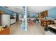 Spacious basement with shelving, offering ample storage or workshop potential at 7941 Sycamore Dr, New Port Richey, FL 34654