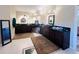 Bathroom with double vanity and dark wood cabinets at 7941 Sycamore Dr, New Port Richey, FL 34654