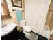 Clean bathroom with shower/tub combo, vanity, and toilet at 7941 Sycamore Dr, New Port Richey, FL 34654