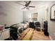 Cozy bedroom featuring a twin bed, dresser, and ceiling fan at 7941 Sycamore Dr, New Port Richey, FL 34654