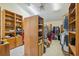 Spacious walk-in closet with shelving units and hanging racks for clothes at 7941 Sycamore Dr, New Port Richey, FL 34654