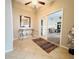 Bright entryway with tile flooring and view into living room at 7941 Sycamore Dr, New Port Richey, FL 34654