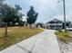 Two-story home with long driveway and landscaping at 7941 Sycamore Dr, New Port Richey, FL 34654