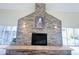 Elegant stone fireplace as a focal point in the living room at 7941 Sycamore Dr, New Port Richey, FL 34654