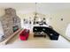 Large game room with pool table, fireplace, and ample seating at 7941 Sycamore Dr, New Port Richey, FL 34654