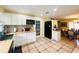 Bright kitchen with butcher block countertops, white cabinets, and stainless steel appliances at 7941 Sycamore Dr, New Port Richey, FL 34654