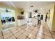 Open concept kitchen with island and views to adjacent office at 7941 Sycamore Dr, New Port Richey, FL 34654