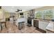Spacious kitchen with stainless steel appliances, island and tile flooring at 7941 Sycamore Dr, New Port Richey, FL 34654