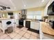 Spacious kitchen offers white cabinets, butcher block countertops, stainless steel appliances and decorative backsplash at 7941 Sycamore Dr, New Port Richey, FL 34654
