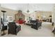 Bright living room with vaulted ceilings, stone fireplace, and multiple seating areas at 7941 Sycamore Dr, New Port Richey, FL 34654