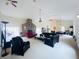 Open living space with a stone fireplace, pool view, and ample seating at 7941 Sycamore Dr, New Port Richey, FL 34654