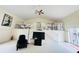 Two-story living room with loft and comfortable seating at 7941 Sycamore Dr, New Port Richey, FL 34654