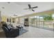 Bright living room features a sitting area with access to the outdoor patio at 7941 Sycamore Dr, New Port Richey, FL 34654