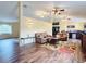 Spacious living room with hardwood floors and comfortable seating at 7941 Sycamore Dr, New Port Richey, FL 34654