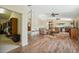 Spacious living room showcasing hardwood floors, comfortable seating, and a closet at 7941 Sycamore Dr, New Port Richey, FL 34654