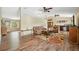 Living room featuring hardwood floors, ceiling fans and comfortable seating at 7941 Sycamore Dr, New Port Richey, FL 34654