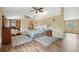 Bright and spacious main bedroom boasting hardwood floors, neutral walls, and a high ceiling with ceiling fans at 7941 Sycamore Dr, New Port Richey, FL 34654