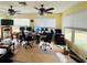 Home office with multiple computer monitors and window views at 7941 Sycamore Dr, New Port Richey, FL 34654