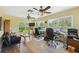 Bright office space with multiple computer workstations and natural light at 7941 Sycamore Dr, New Port Richey, FL 34654