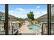 Backyard view of the pool, jacuzzi, patio, and landscaping as seen through glass doors at 7941 Sycamore Dr, New Port Richey, FL 34654