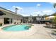 Backyard view of large private swimming pool with jacuzzi, patio, and outdoor seating at 7941 Sycamore Dr, New Port Richey, FL 34654