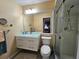 Updated bathroom with glass shower, vanity, and toilet at 9163 Lingrove Rd, Weeki Wachee, FL 34613