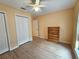 Bright bedroom with double door closet and laminate flooring at 9163 Lingrove Rd, Weeki Wachee, FL 34613