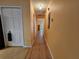 Clean hallway with wood floors and neutral walls at 9163 Lingrove Rd, Weeki Wachee, FL 34613