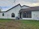 Rear view of house showing screened porch at 9163 Lingrove Rd, Weeki Wachee, FL 34613
