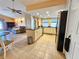 Open kitchen with granite counters, stainless steel appliances and breakfast bar at 9163 Lingrove Rd, Weeki Wachee, FL 34613