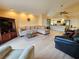 Bright living room with hardwood floors and open kitchen view at 9163 Lingrove Rd, Weeki Wachee, FL 34613