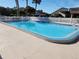 Inviting community swimming pool with surrounding patio at 9163 Lingrove Rd, Weeki Wachee, FL 34613