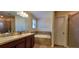Main bathroom with double vanity, garden tub, and shower at 10167 Bankston Dr, Hudson, FL 34667