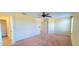 Spacious bedroom with carpeted floors and access to a hallway bathroom at 10167 Bankston Dr, Hudson, FL 34667