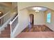 Formal dining room with hardwood floors and an arched entryway at 10167 Bankston Dr, Hudson, FL 34667