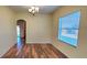 Bright dining room featuring hardwood floors and a view to the backyard at 10167 Bankston Dr, Hudson, FL 34667