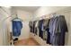 Spacious walk-in closet with ample shelving and hanging rods at 10167 Bankston Dr, Hudson, FL 34667