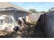 Backyard with wooden fence and gate at 11366 Riddle Dr, Spring Hill, FL 34609