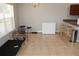 Dining area with tile floors and a large window at 11366 Riddle Dr, Spring Hill, FL 34609