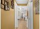 Inviting hallway with warm-toned walls and tile floors at 12216 Silk Oak Ln, Hudson, FL 34667