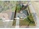 Aerial view of a house with a pool and detached garage at 12499 Convent Garden Rd, Brooksville, FL 34613