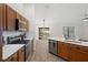 Bright kitchen with stainless steel appliances and bar seating at 12499 Convent Garden Rd, Brooksville, FL 34613