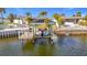 Enjoy waterfront living with this private boat lift at 12832 3Rd Isle, Hudson, FL 34667