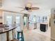 Modern kitchen with white cabinets and island at 12832 3Rd Isle, Hudson, FL 34667