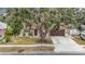 Housetop view of a single-story home with large tree and driveway at 1310 Mandarin Dr, Holiday, FL 34691