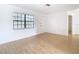 Living room featuring light wood flooring and a window with blinds at 1310 Mandarin Dr, Holiday, FL 34691