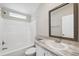 Clean bathroom with a shower/tub combo and updated vanity at 1852 Cypress Point Ln, Sarasota, FL 34234