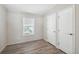 Bright bedroom with hardwood floors and neutral decor at 1852 Cypress Point Ln, Sarasota, FL 34234